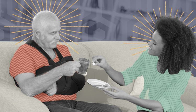 Caregiver assisting an older adult at home